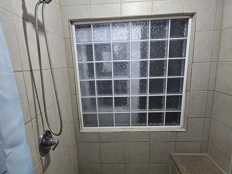 Large walk in shower with seat
