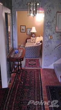 The entry hall offers a large size coat closet, niche for a furniture piece and a nice focal point to greet all visitors.