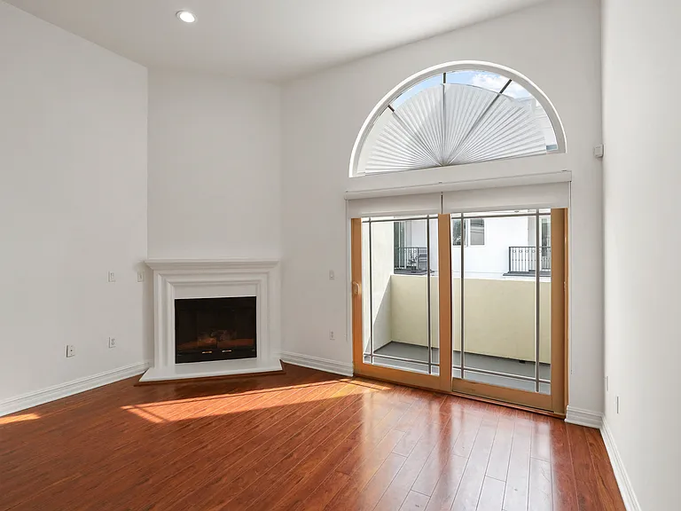 Living Room with Fireplace and Balcony