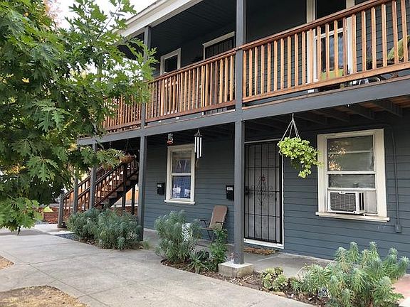 Top floor, full flat with 125 foot outdoor covered porch overlooking wide, tree-lined 2nd Avenue.