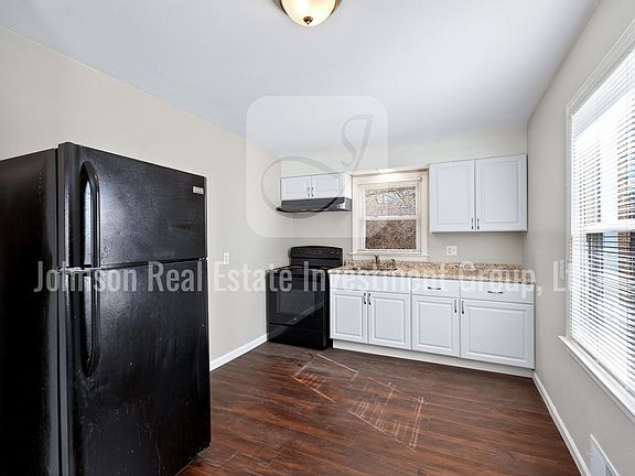 Kitchen w/ new cabinets, countertops and luxury vinyl plank flooring.