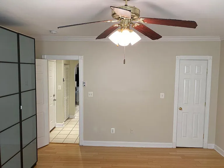 bedroom with two closets and a wardrobe