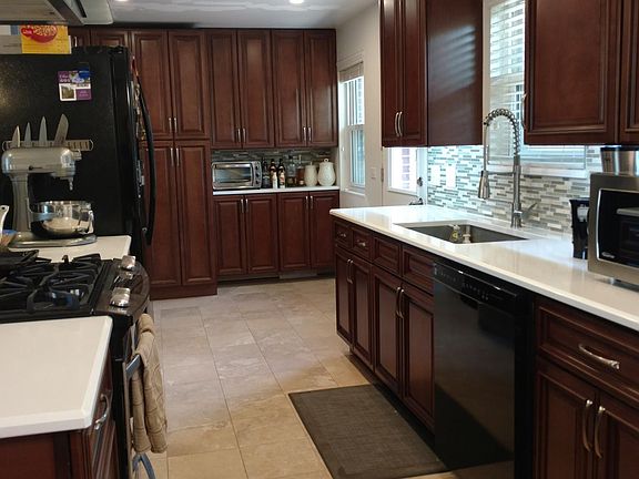 Remodeled Kitchen in 2016 with travertine floors and quartz 