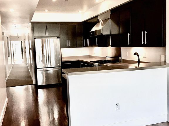 kitchen with 6 burner gas range, dish washer and garbage disposer.