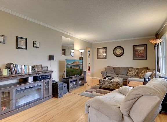 Spacious main level living room with hardwood floors throughout.