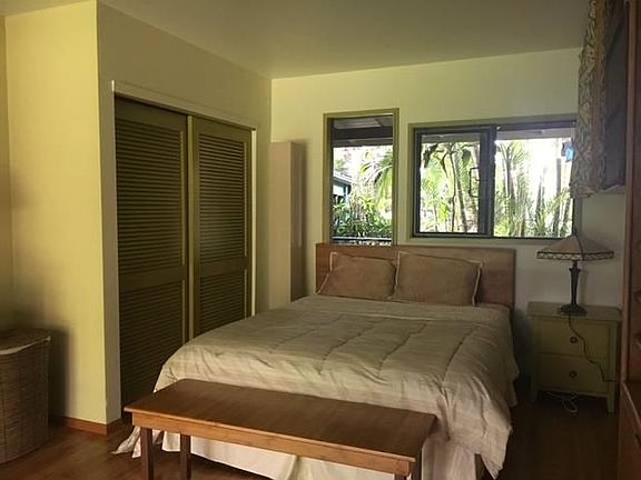 Bad photo.. of one of the bedrooms with teak furnishing included