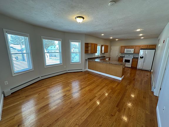 Spacious open concept apartment with high ceilings and plenty of daylight! Here is the Living Room adjacent to Kitchen