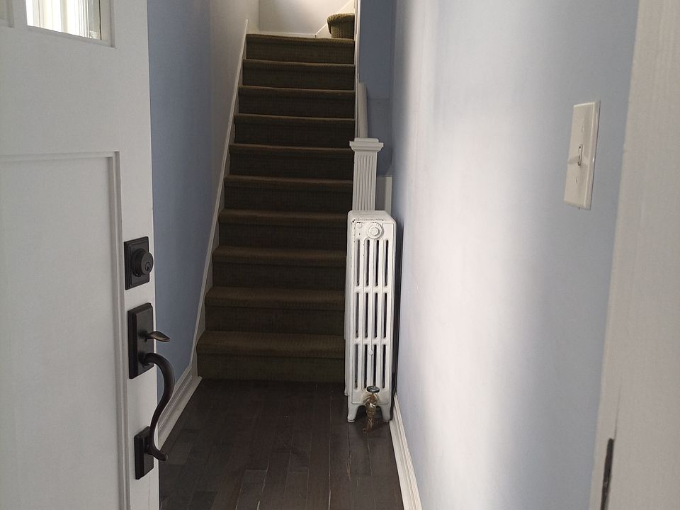 There is a small vestibule/mudroom between the front door and the entrance to the apartment