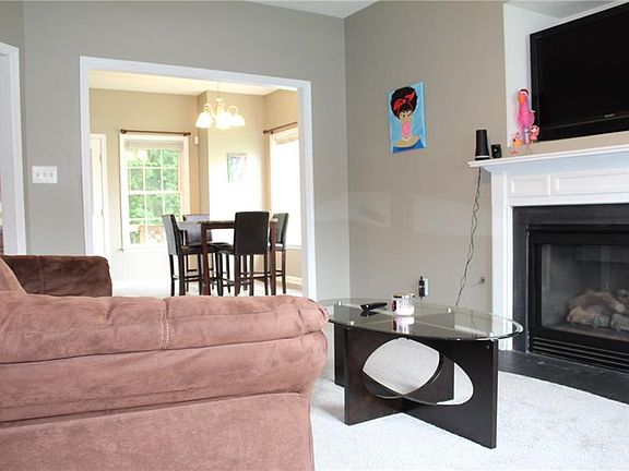 Living room with gas fireplace.