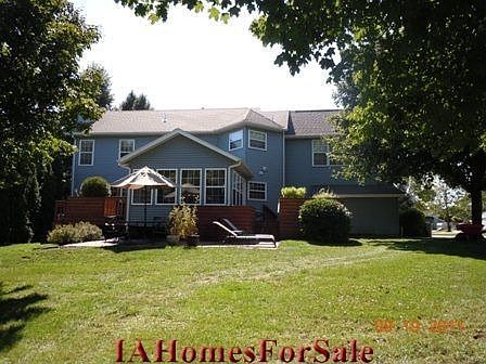 Backyard with new red brick patio and matching storage shed