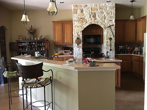 Stone surround at stove