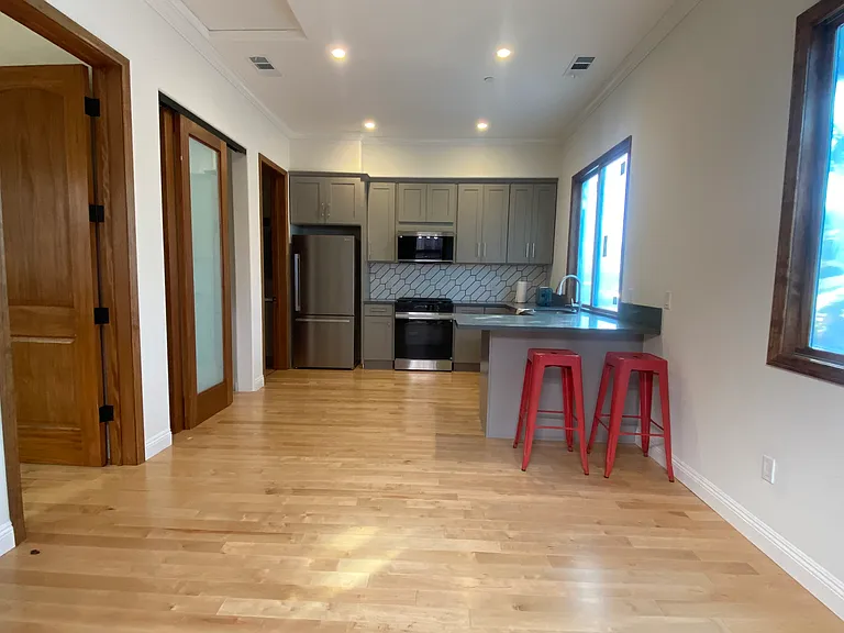 open floor plan with 10 feet ceiling. recessed lighting, hardwood flooring