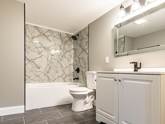 BASEMENT BATHROOM HAS A FULL SIZE BATHTUB/SHOWER!