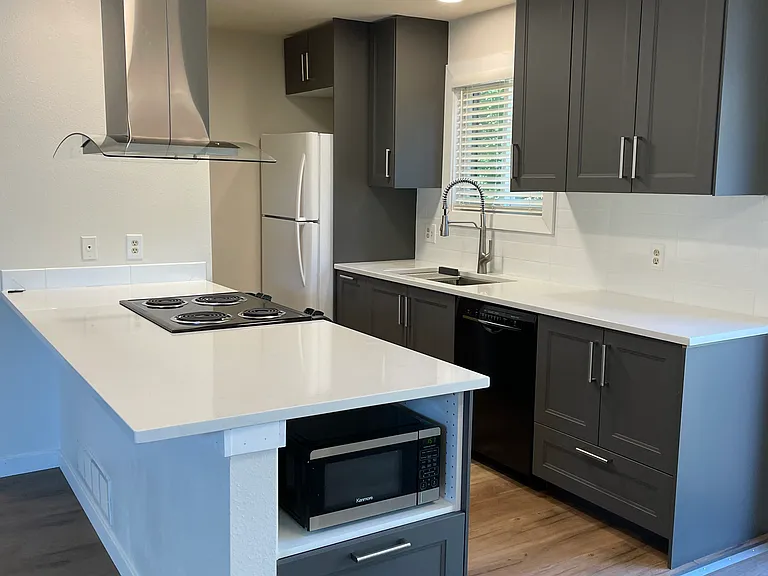 Newly renovated kitchen with quartz countertops