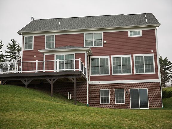 Back of the house
						:
						View is from the backyard. There's the sliding door to the walkout basement.