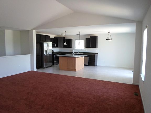 Open great room with cathedral ceiling.