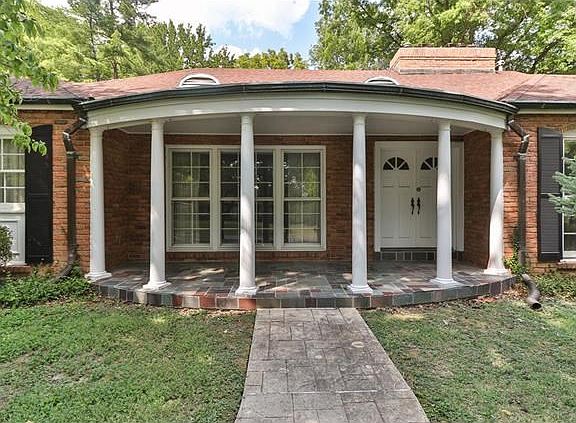 Spacious front porch with double door entry.
