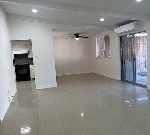 Living room and dining room have access to back patio and to kitchen.