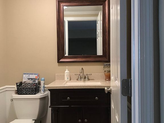Newly renovated half bathroom in the downstairs finished family room.