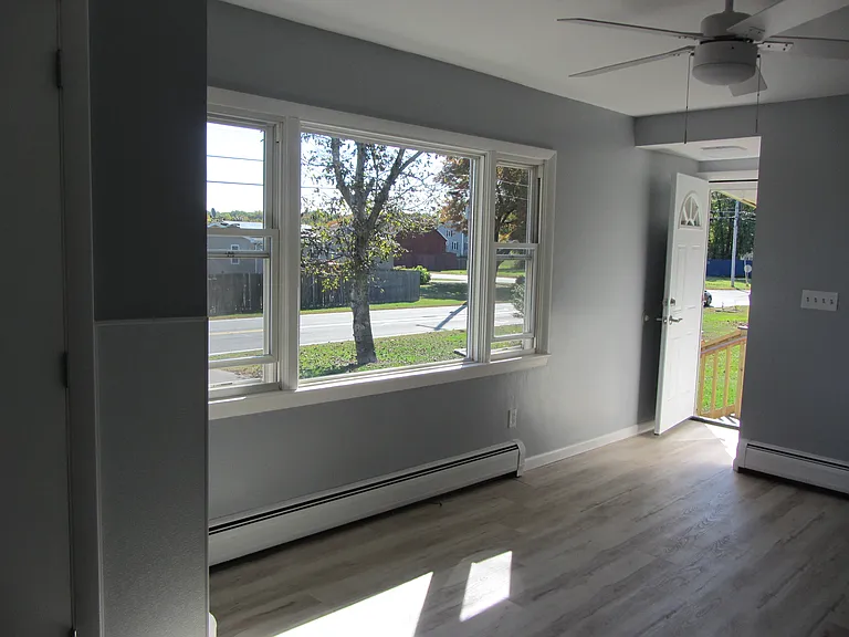 View from living room out side door onto covered porch.