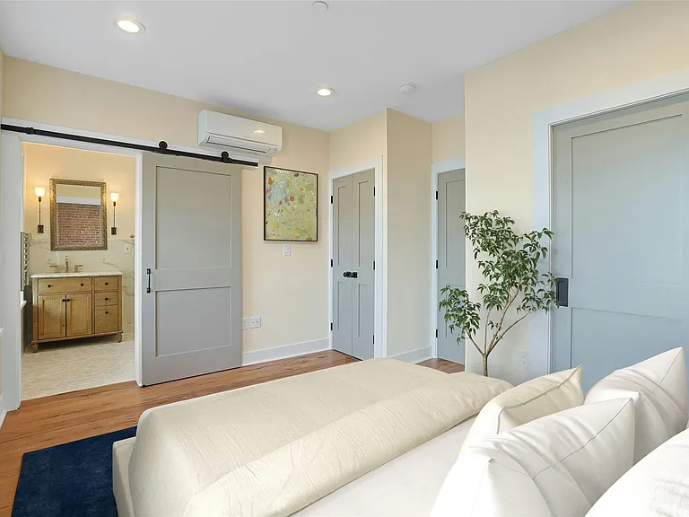 Bedroom: Virtually staged light-filled bedroom with en-suite bathroom and walk in closet.