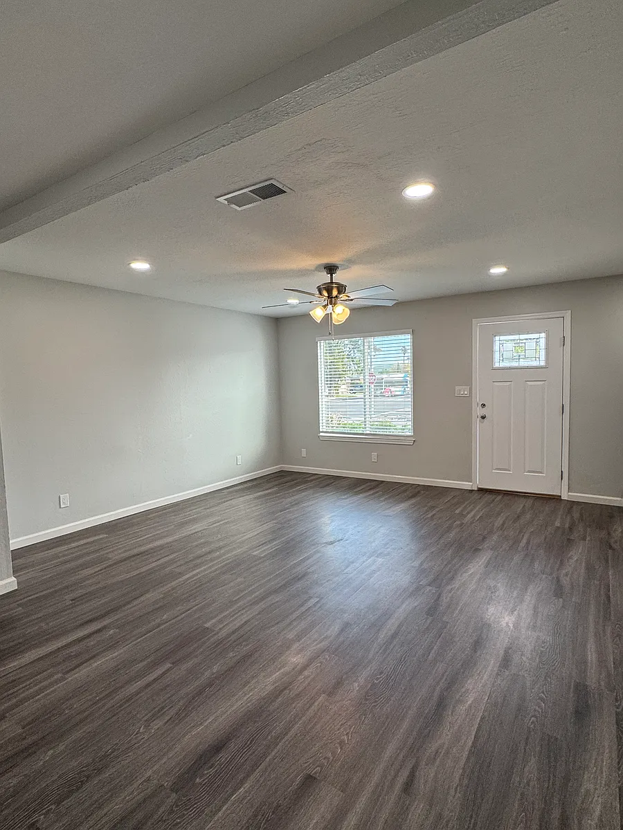 Living room area with large front window for plenty of natural lighting - 1063 Bluebell Dr #5