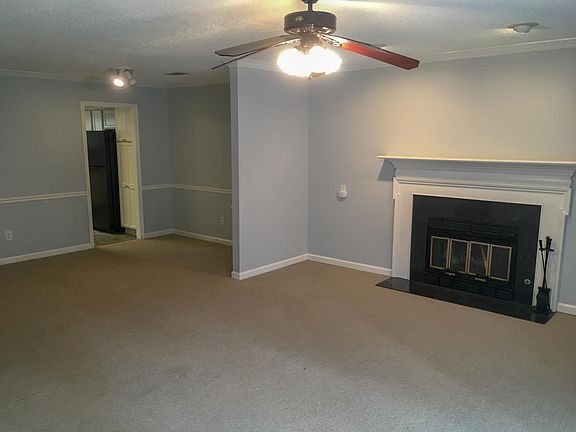 working fireplace and adjacent dining room
