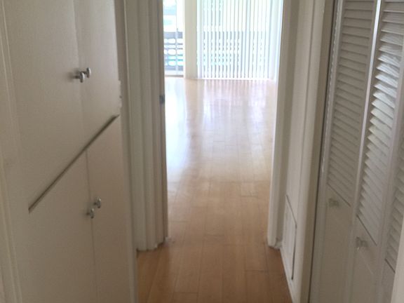 Hallway to bedroom with plenty of Storage.