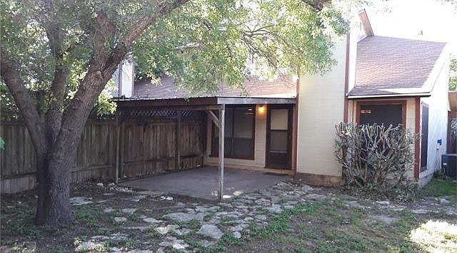 Fenced back yard with 13x13 foot patio with metal roof.