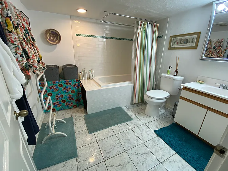 Basement full bathroom with hot tub towels