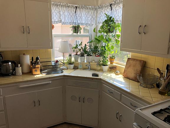 Huge cooking space, lots of cupboards, plenty of counter space, gas stove, portable dishwasher, even an in wall ironing board!