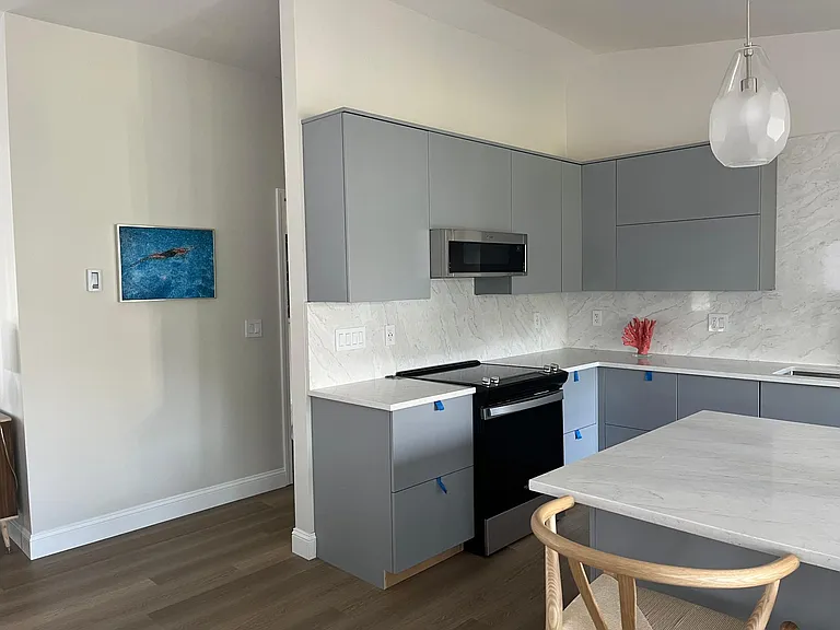 Newly renovated kitchen with vaulted ceilings.