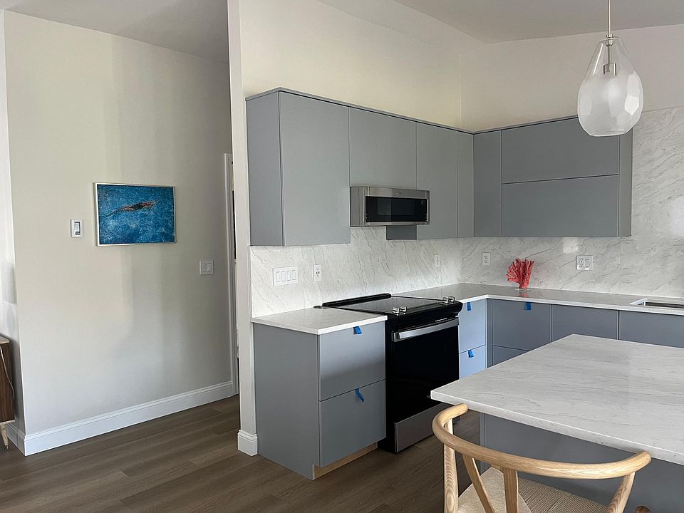 Newly renovated kitchen with vaulted ceilings.