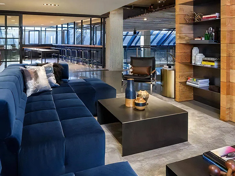 Indoor Lounge Space with Built-In Shelving and Shared Seating Options