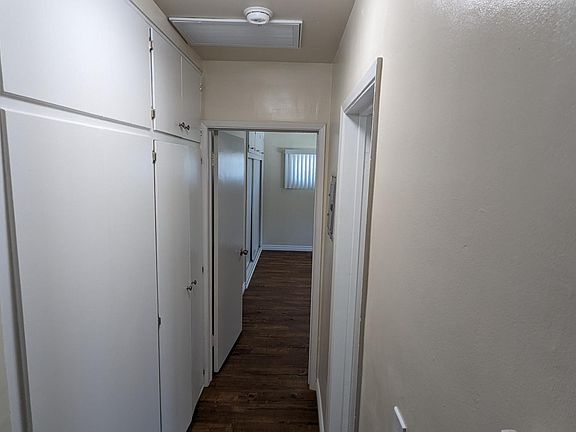 Hallway with bonus closet