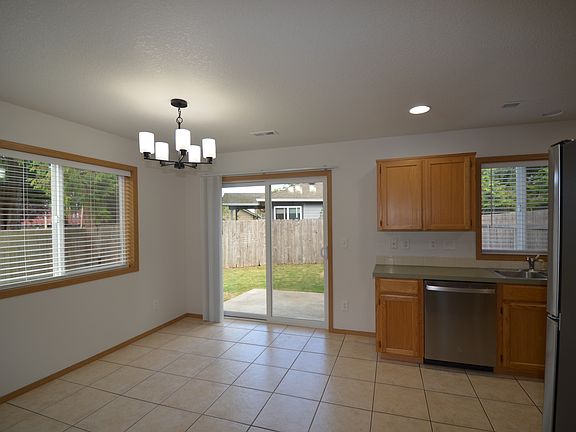 Kitchen, slider to patio and back yard