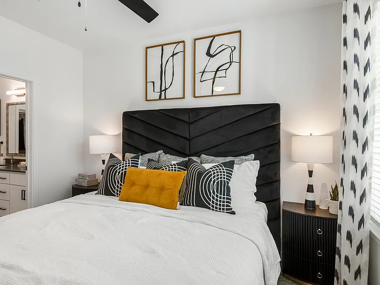Private Bedroom with Attached Bath and Decorative Accent Pillows