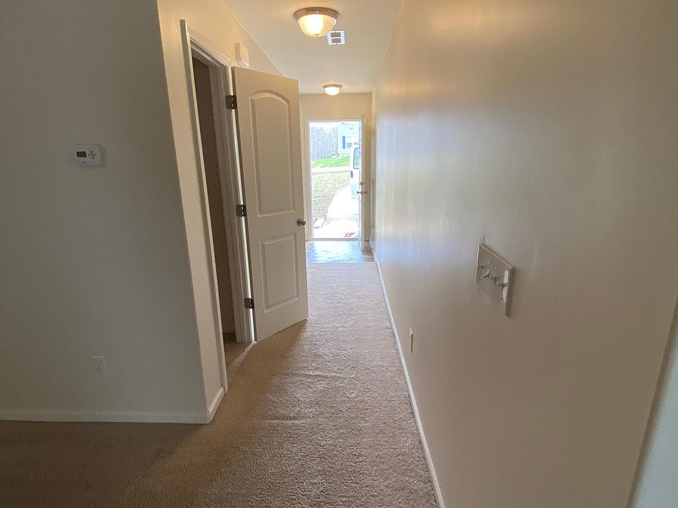 front door thru hallway. to den room and kitchen. pass thru 1/2 bathroom and closet.