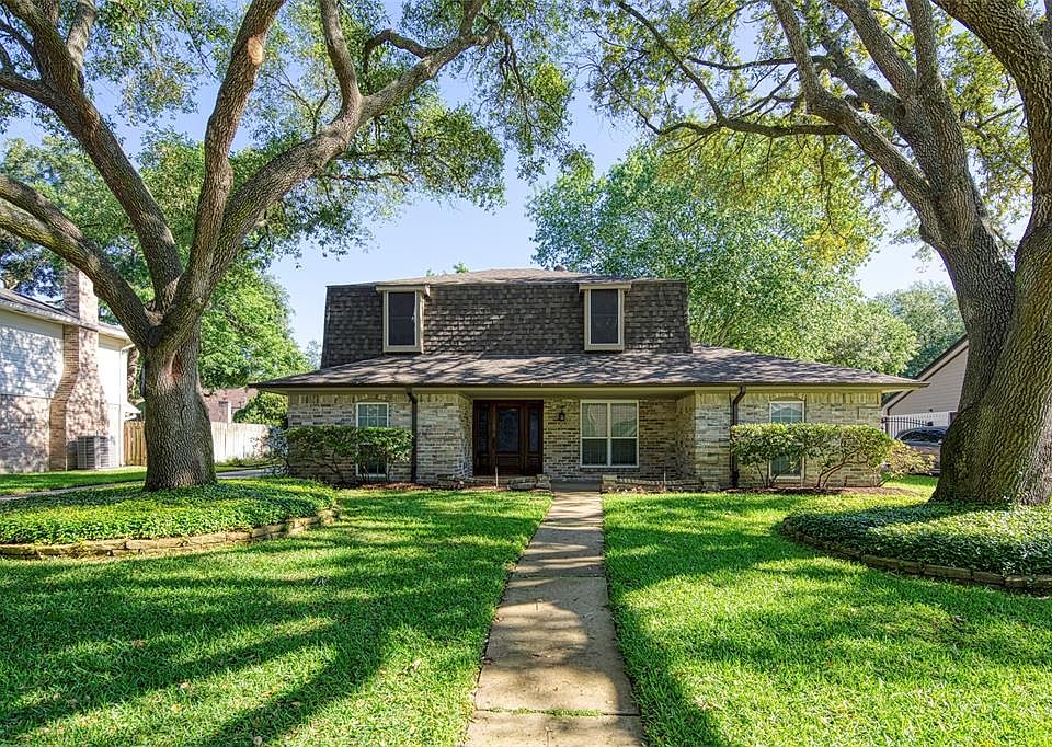 Traditional Four Bedrooms, Master down, 2.5 Baths, 2 Car Detached Garage, Family Home Framed by Beautifully Trimmed Oaks out Front.