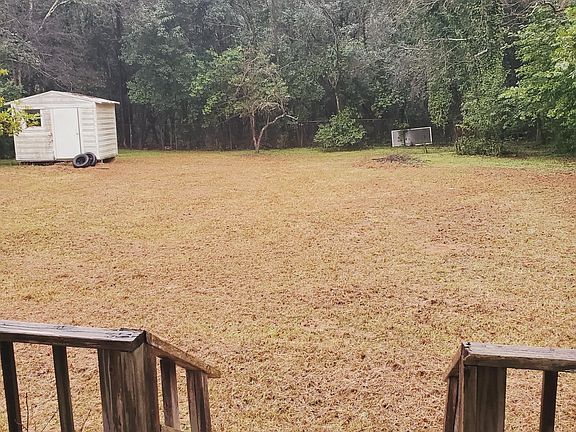 Large backyard with storage house