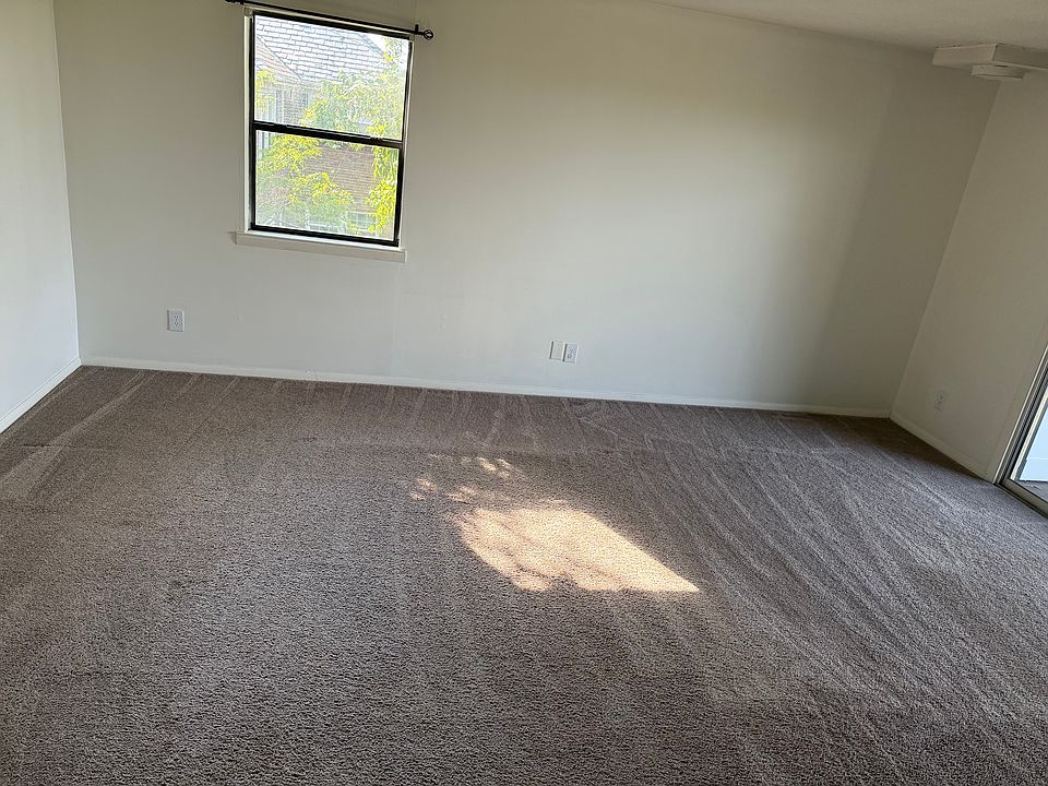 large living area with slider door access to outdoor porch with sweeping views