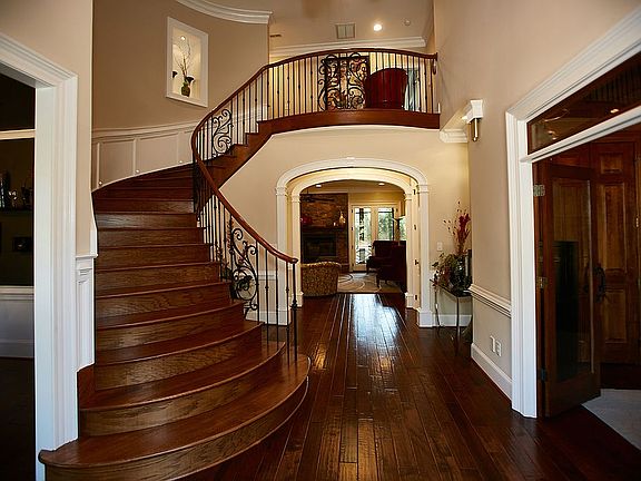 Entry with curved staircase