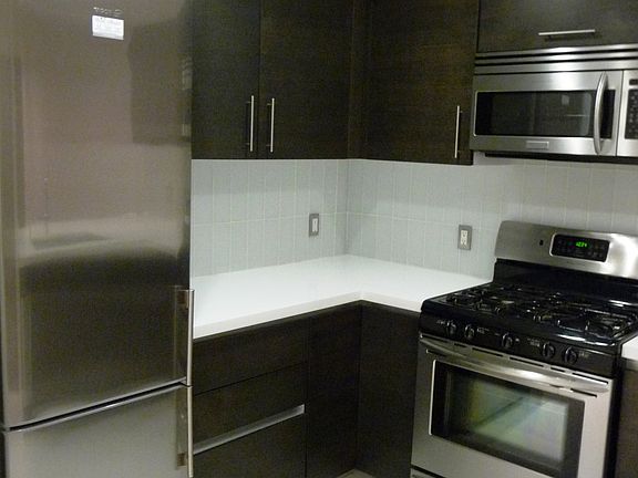 Gourmet kitchen with stainless steel appliances and custom Italian cabinetry