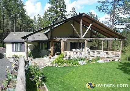 View down Drive, Front of Log Accented Home