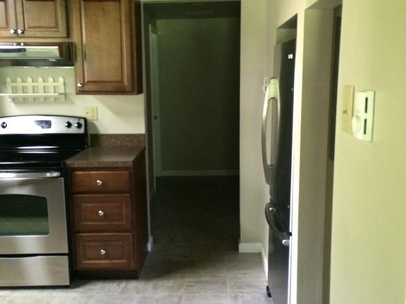 Hallway leads to bathroom and laundry room.