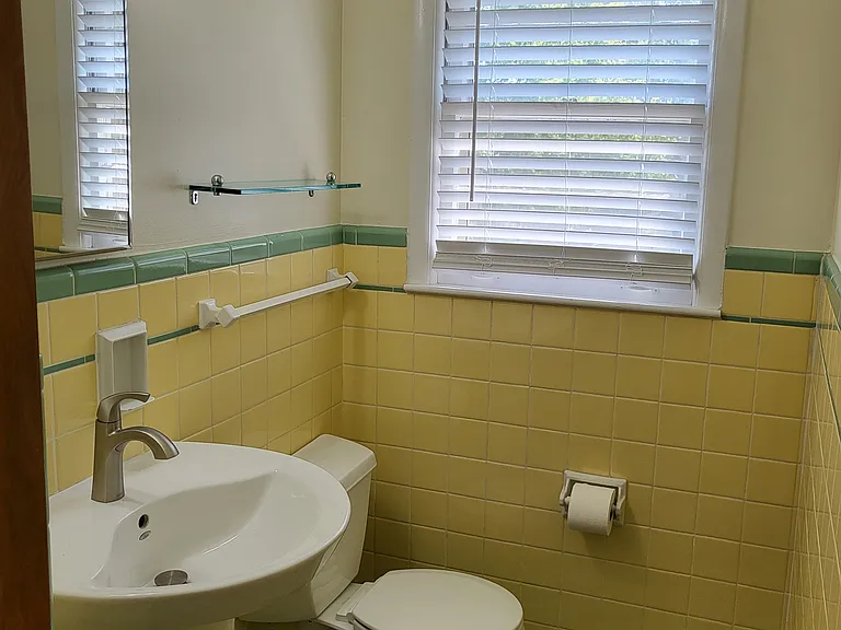 vintage yet updated 1/2 bathroom. Large linen closet.