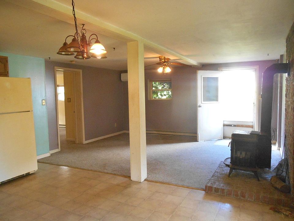 Open living area with wood stove, mini-split heat and AC