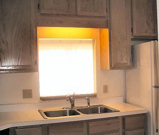 Passthru window in the kitchen looking towards the living room