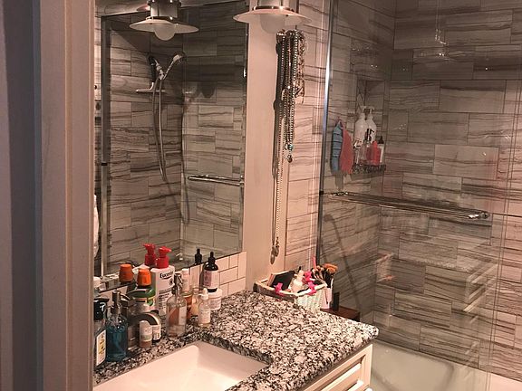 tiled shower, granite countertop