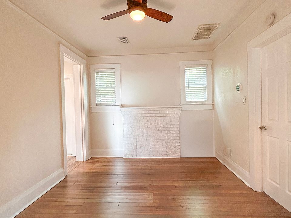 Living room with historic wood floors and high ceilings